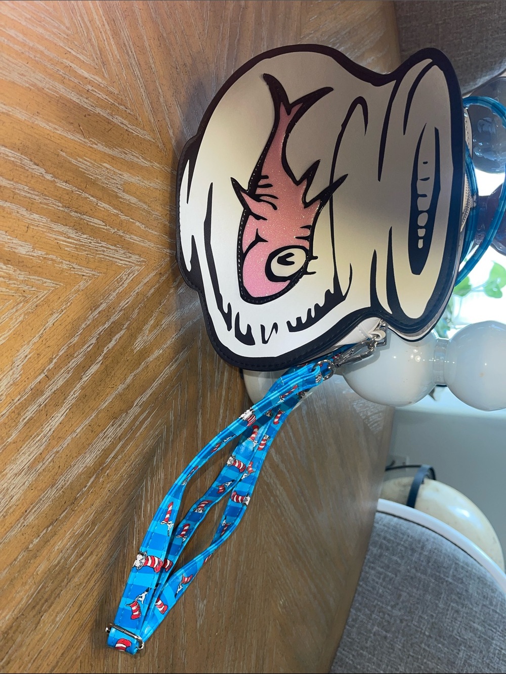 Dr. Seuss Blue Fish Cup Character cross body small bag with adjustable strap.